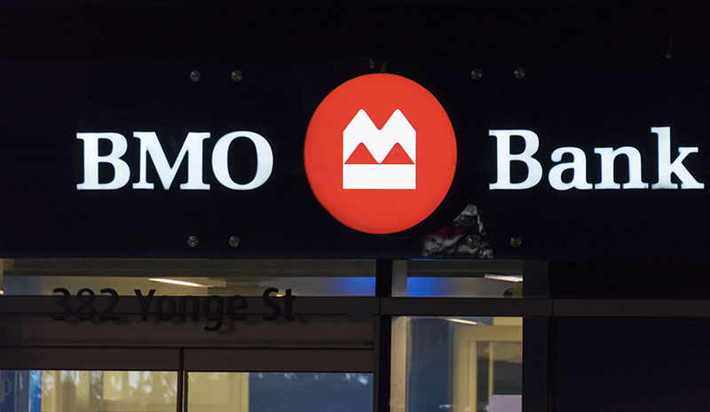 UPDATE 4-Bank of Montreal to axe 4 pct of workforce, warns on loans  